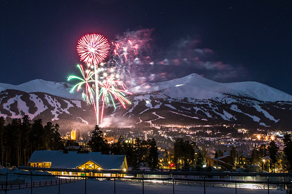 Fireworks above the Town of Breckenridge with the mountains and ski runs in the background