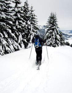A person snowshoeing on a snowy day.