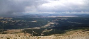 A vista on a cloudy day from the top of Hoosier Pass that shows the valley below.